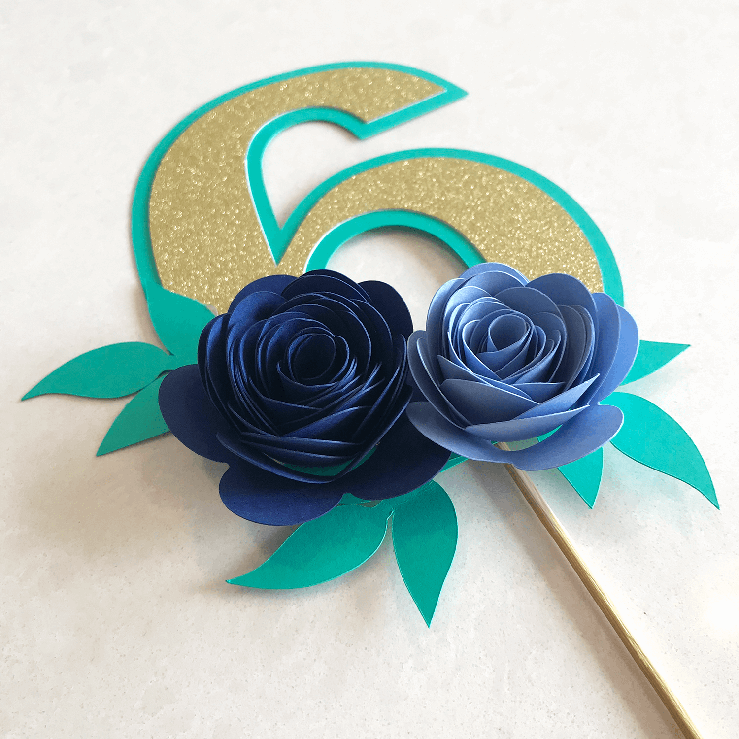 teal and gold floral cake topper